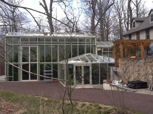 The stormwater storage cistern is beneath the patio under the pergola. You would never know it was there. It can hold enough rain water to irrigate all the plants in the greenhouse all winter. In the spring they move the plants out to the pleasure garden.
